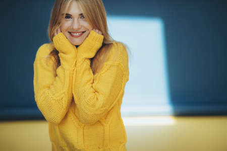 Woman in a sweater in the studio. High quality photoの写真素材