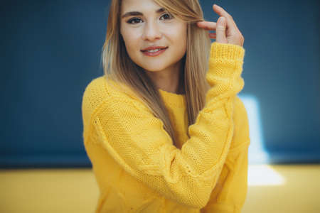 Woman in a sweater in the studio. High quality photoの写真素材
