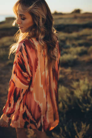 Beautiful woman. Young woman, sunlight, sunset. High quality photoの写真素材
