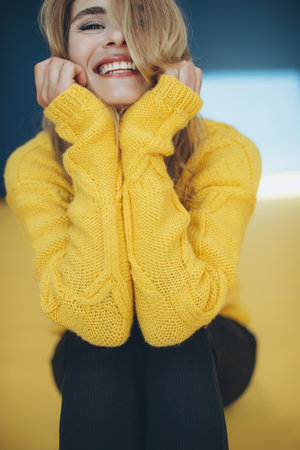 Woman in a sweater in the studio. High quality photoの写真素材