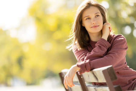 Beautiful woman. Young girl portrait in nature in autumn. High quality photoの写真素材
