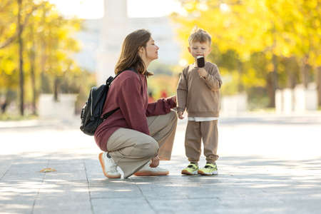 Mom with a child. Happy family in nature. Beautiful woman with a small child in nature. High quality photoの写真素材