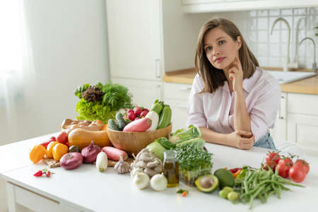 Woman with vegetables. Proper nutrition. High quality photoの写真素材