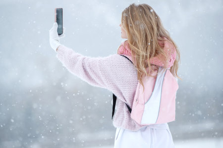 Woman travels in winter. Beautiful girl in the winter in nature. High quality photoの写真素材