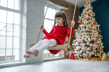 Child at Christmas. Little girl on a holiday. High quality photoの写真素材