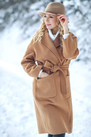 Woman travels in winter. Beautiful girl in the winter in nature. High quality photoの写真素材