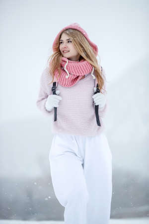 Woman travels in winter. Beautiful girl in the winter in nature. High quality photoの写真素材