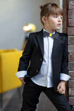 Fashionable child. The little girl is fashionably dressed. School style. High quality photoの写真素材