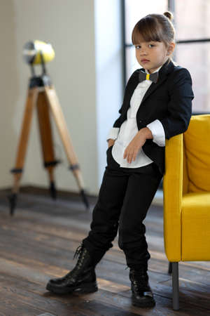 Fashionable child. The little girl is fashionably dressed. School style. High quality photoの写真素材