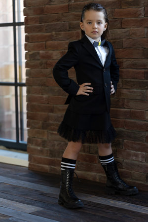 Fashionable child. The little girl is fashionably dressed. School style. High quality photoの写真素材