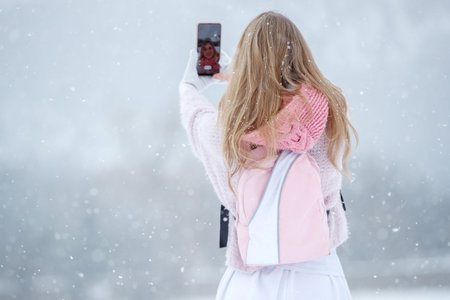 Woman travels in winter. Beautiful girl in the winter in nature. High quality photoの写真素材