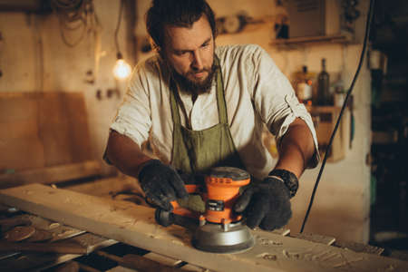Male joiner at the workplace. High quality photoの写真素材