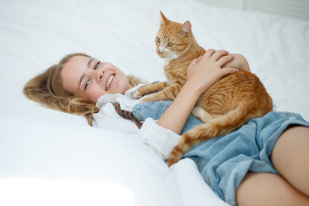 Girl teenager with a cat. High quality photoの写真素材