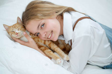 Girl teenager with a cat. High quality photoの写真素材
