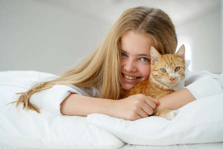 Girl teenager with a cat. High quality photoの写真素材