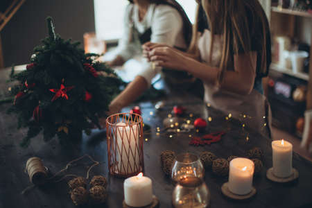 A woman makes a Christmas tree with her own hands. High quality photoの写真素材