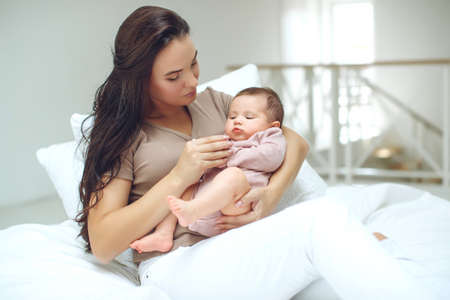 Mom with a baby at home. High quality photoの写真素材