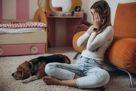 Teenage girl in depression in her room. High quality photoの写真素材