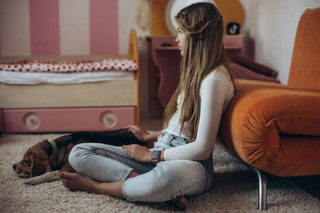 Teenage girl in depression in her room. High quality photoの写真素材