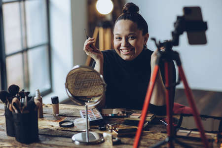 A woman does makeup live. High quality photoの写真素材