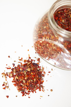 A mixture of spices. Paprika. Spices loose and in a glass jarの写真素材