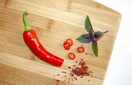 Red chili pepper on a wooden kitchen board. Spice. Cooking Backgroundの写真素材