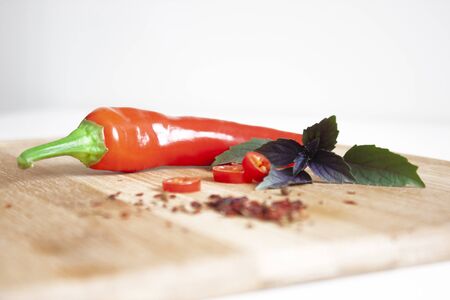 Red chili pepper on a wooden kitchen board. Spice. Cooking Backgroundの写真素材