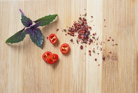 Spices of pepper and leaves of Ocimum basilicumの写真素材