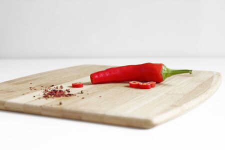 Red chili pepper on a wooden kitchen board. Spice. Cooking Backgroundの写真素材