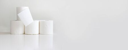 Rolls of toilet paper on light gray background. Horizontal bannerの写真素材