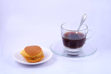 custard cake and coffee cup group of object on white backgroundの写真素材