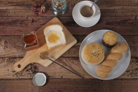 Top Views of bakeries and coffee cup on the wooden tableの写真素材