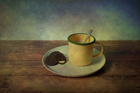 picture of milk mugh, crackers on a white plate in vintage backgroundの写真素材