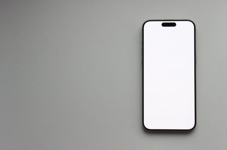 Smartphone Mockup with empty white display on light gray background, wide copy space for design or brandingの写真素材