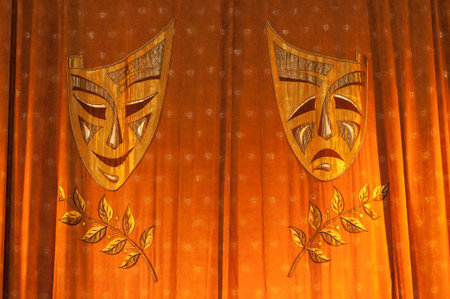 Comedy Tragedy. Curtains with masks in the theater