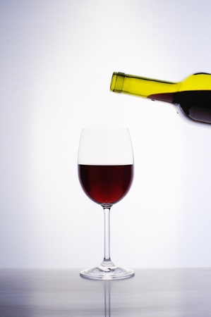 Classic glass of red wine isolated on a white backgroundの写真素材