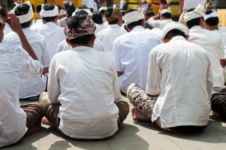 Boys praying in hindu temple Pura Tirta Empul, Bali, Indonesia
