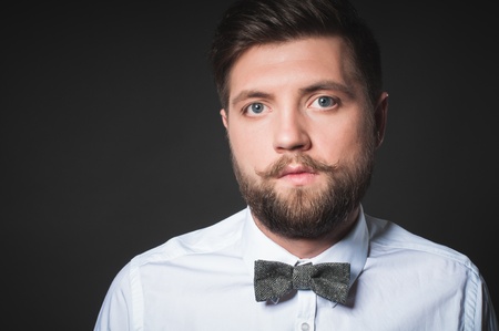 Studio portrait of young man with great beardの写真素材