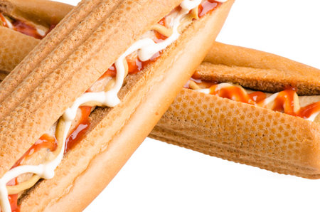 Hot dogs with mustard and ketchup isolated on white background