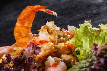 Hibachi rice with seafoods, prawns and lettuceの写真素材