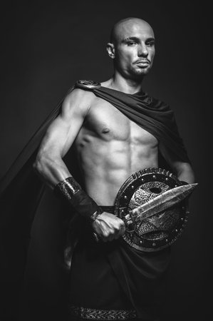 Studio portrait of man in spartan costumeの写真素材