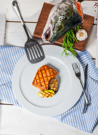 Grilled salmon with vegetables and rosemaryの写真素材