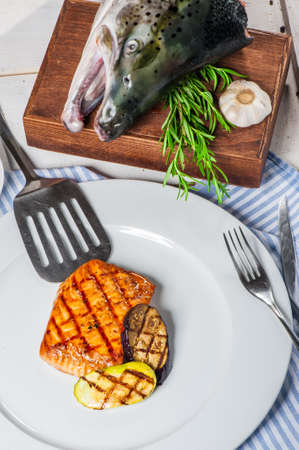 Grilled salmon with vegetables and rosemaryの写真素材