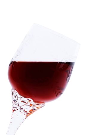 Red wine in an elegant glass inclined at a small angle. It is isolated on a white background.Hand made clipping path insideの写真素材