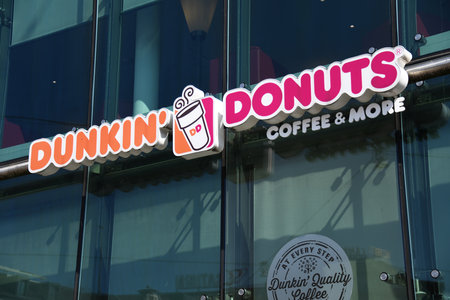 Hanover, Lower Saxony, Germany - April 12, 2020: logo of dunkin donuts in Hanover, Germany - Dunkin' is an American multinational coffee and donut companyのeditorial素材