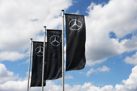 Celle, Lower Saxony, Germany - June 5, 2020: Flags at the entrance of a Mercedes store in Celle, Germany - Mercedes is a global automobile marque, a division of Daimler AGのeditorial素材