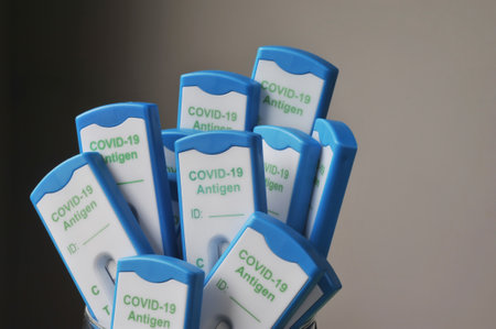 Burgdorf, Lower Saxyony, Germany - February 9, 2022: A large amount of different covid-19 antigen rapid tests with negative test resultsのeditorial素材