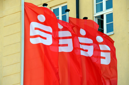 Luckenwalde, Brandenburg, Germany - May 09, 2016: Flags with the Logo of the german Savings Bank - Sparkasse - in front of a branch in Luckenwalde, Germanyのeditorial素材