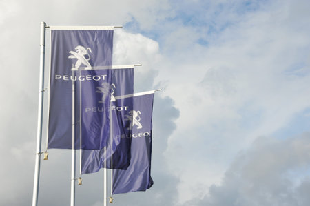 Hamburg, Germany - October 3, 2017: Flag at the entrance of a Peugeot store in Hamburg, Germany -...
