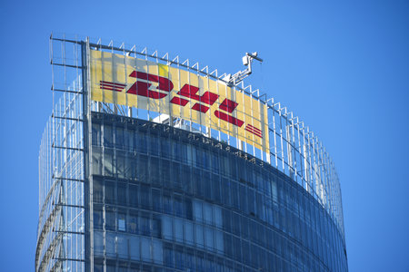 Bonn, North Rhine-Westphalia, Germany - September 25, 2018: DHL sign at the top of Post Tower, headquarters of the world's largest logistics company Deutsche Post DHL in Bonn, Germanyのeditorial素材